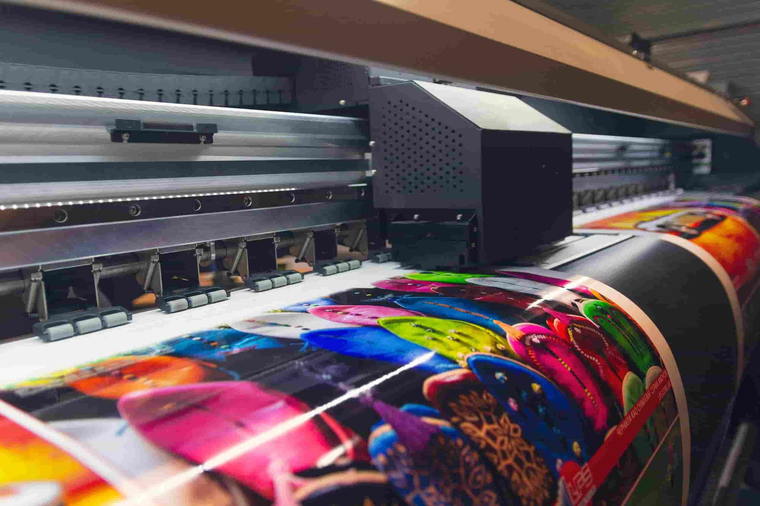 Large format printing machine in operation. Industry-min